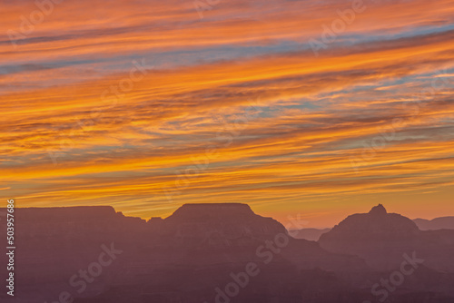 Fiery Sunrise Above Silhouette of Grand Canyon in the Morning