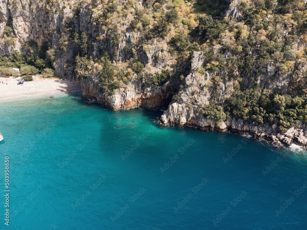 Sea waves on the wild rocky coast. Beautiful seascape. Travel concept. Seascape on the background of the wild rocky coast. Azure water and rocks. Aegean Sea, Turkey. Postcard view. Drone shot Sea waves on the wild rocky coast. Beautiful seascape. Travel concept. Seascape on the background of the wild rocky coast. Azure water and rocks. Aegean Sea, Turkey. Postcard view. Drone shot