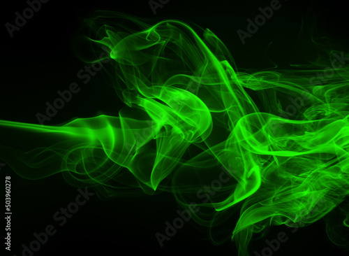 Green smoke abstract on black background, darkness concept
