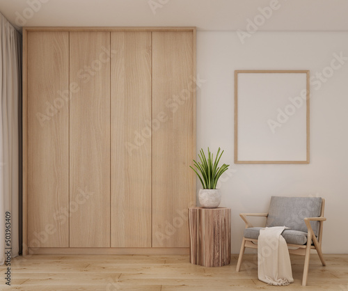 Fototapeta Naklejka Na Ścianę i Meble -  Modern minimal scandinavian living room interior with wood built-in cabinet,wooden floor,wooden grey armchair,wooden empty frame,wooden side table,green plant and fabric in 3d rendering.