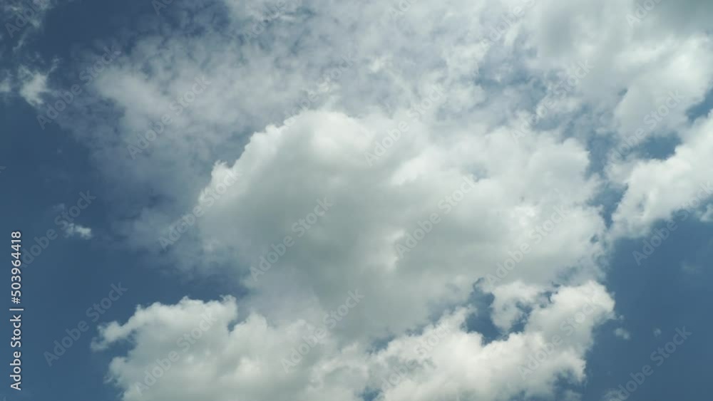 White clouds in the blue sky. Clouds float across the sky. White clouds in the blue sky. Clouds float across the sky.