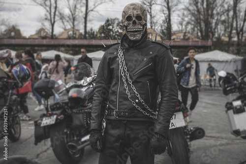 A biker in a ghost rider costume. Costume based on the fantastic action movie "Ghost Rider"