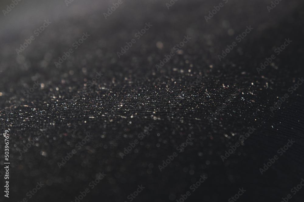 Black abstract background with a close-up pattern of plastic texture. Selective focus Black abstract background with a close-up pattern of plastic texture. Selective focus