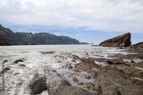 Rocky ocean coast with cliffs in cloudy weather before a storm