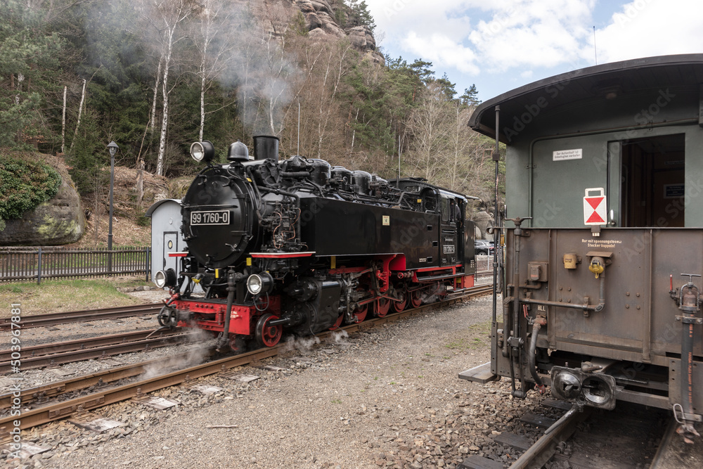 Historic steam powered railway train at train station Oybin. Saxony. Germany