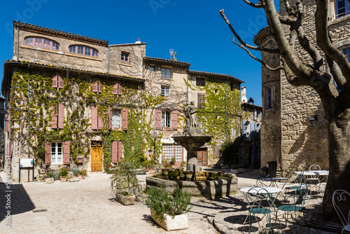 Fototapeta Naklejka Na Ścianę i Meble -  Saignon, France - April 2022: The beautiful fountain of Saignon in the center of the charming village in the south of France