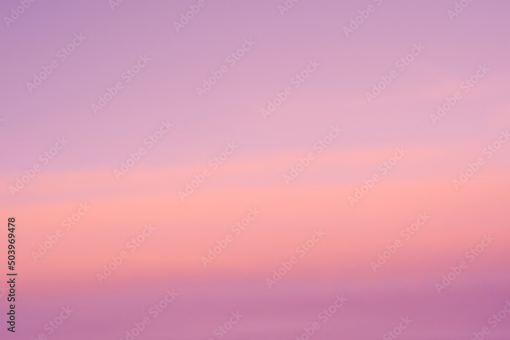 Background of sunrise sky with gentle colors of soft clouds. Dawn sky with colorfull clouds.