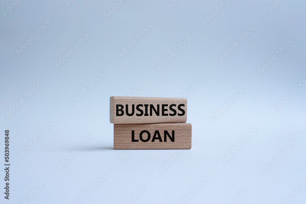 Business loan symbol. Concept words business loan on wooden blocks. Beautiful white background. Business and business loan concept. Copy space. Business loan symbol. Concept words business loan on wooden blocks. Beautiful white background. Business and business loan concept. Copy space.
