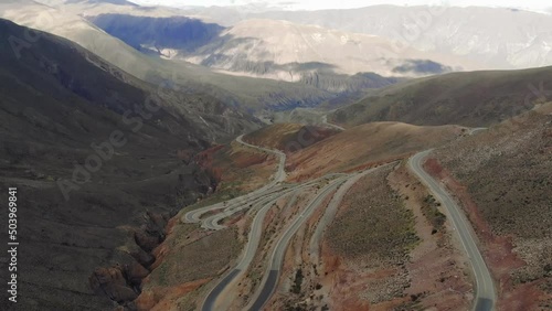 Drone Aerial View Of The Serpentine Road With Many Hairpin Turns On The High Mountain Slope photo