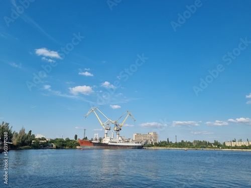 Mykolaiv, Ukraine - . September 4, 2021. Cranes in the port where ships can be repaired. View from the riverside
