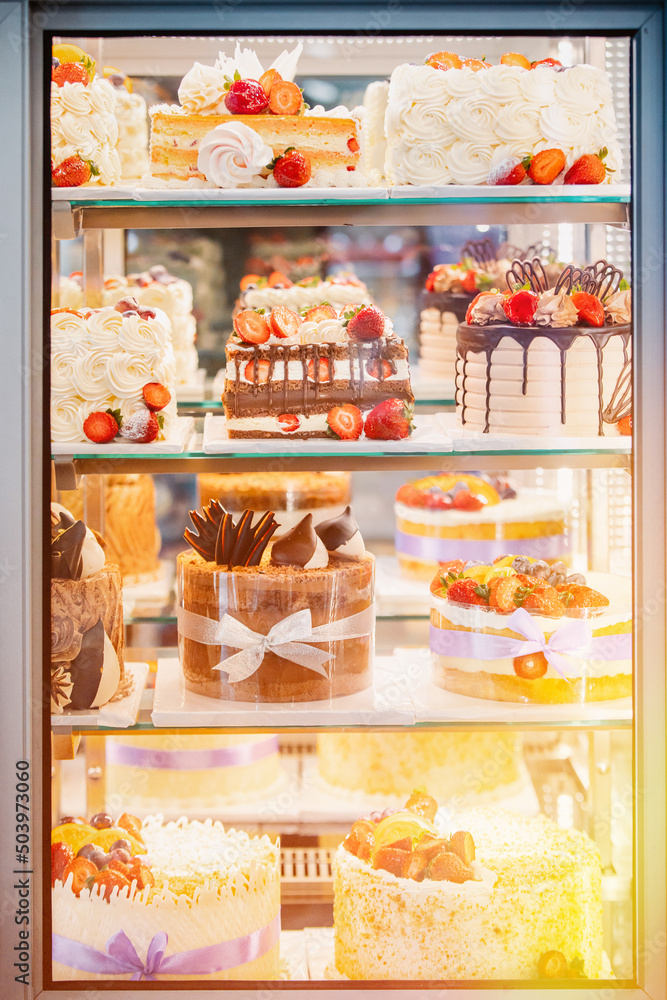 yummy assortment baked pastry in bakery. Various Different Types Of Sweet Cakes In Pastry Shop Glass Display. Good Assortment Of Confectionery. buffet with many desserts. yummy assortment baked pastry in bakery. Various Different Types Of Sweet Cakes In Pastry Shop Glass Display. Good Assortment Of Confectionery. buffet with many desserts.