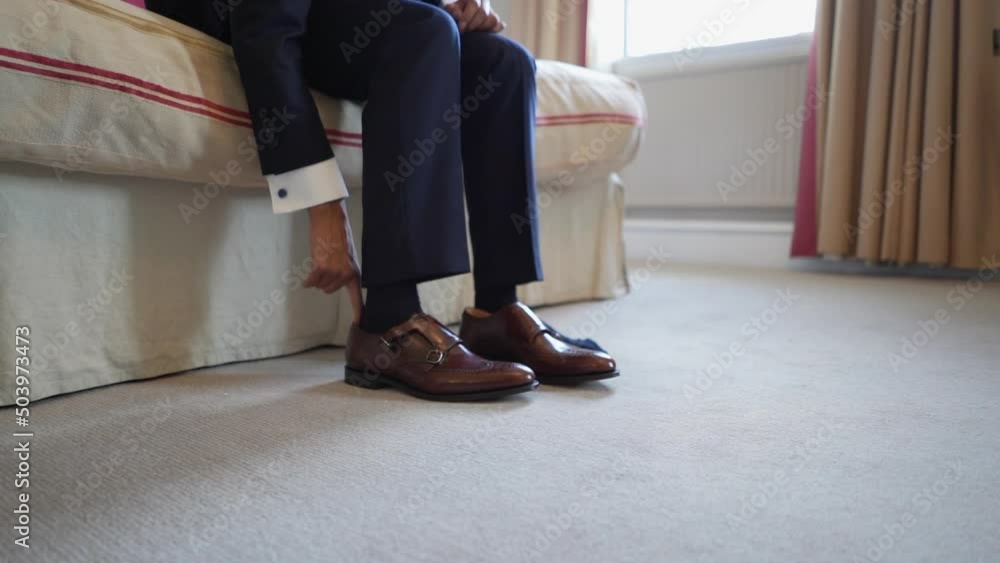 A groom is getting ready for the vanue.
