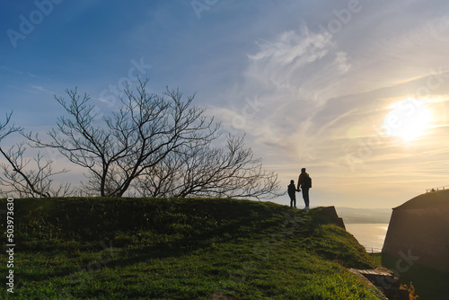 Silhouette of Father and Son in Serbia at Sunset