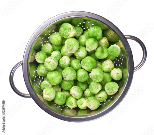 Brussels sprouts in metal bowl isolated on white background, top view.