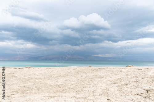 Fotografia, Obraz Exotic view of the sinkhole area of the Dead Sea on a stormy winter day