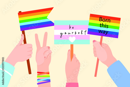 People hold signs and placards with lgbt rainbow during pride month celebration against violence, descrimination, human rights violation. Equality and self-affirmarmation. Pride month. photo