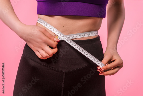Weight loss concept with measuring tape. Sport, healthy lifestyle