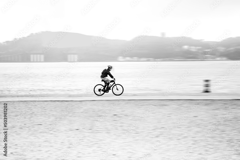 Fototapeta premium person riding a bike