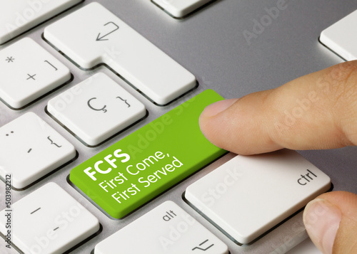 FCFS First Come, First Served - Inscription on Green Keyboard Key.