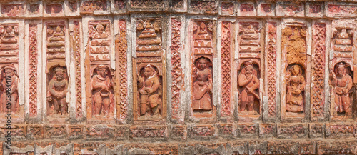 Terracotta art works on the temple walls of Lalji temple of Kalna, West Bengal, India - It is one of oldest temples of lord Krishna (a Hindu Gd) . photo