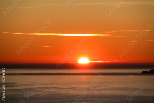 Panoramic sunset view from Praiano at Mediterranean Sea, Italy, Campania, Europe. Silhouette of Li Galli islands and horizon near Amalfi Coast. Reflection of sun beams on water surface during twilight