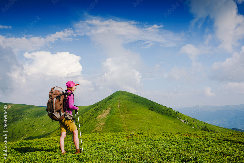 woman backpacker in the mountains enjoy the view woman backpacker in the mountains enjoy the view