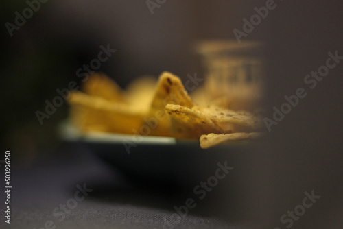 Nacho chips with cheddar cheese sauce for dipping snack mexican food style tex-mex