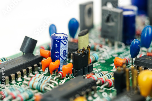 Electronic and Resistor component capacitor on a printed circuit board.	 photo