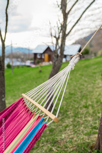 Burgundy hammock for outdoor recreation. Mountain view.