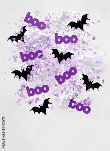 Cute Halloween Card with Black Flying Bats  Violet Boo and Shrimmering Confetti on a White Background. Composition with Bats Cut from Black Paper ideal for Card  Wall Art  Banner  Invitation  Poster. 
