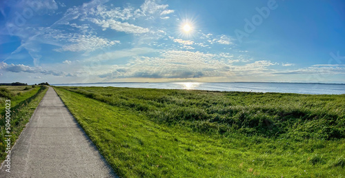 Straight walking path to Ummanz island during summer