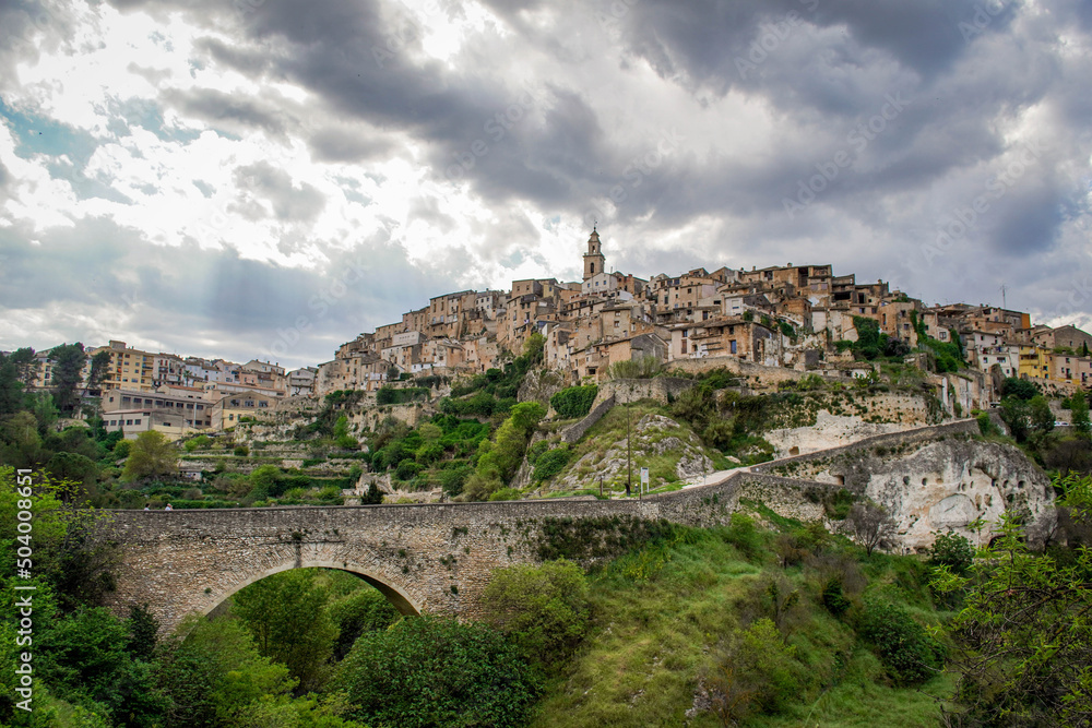 General View of the Beautiful Valencian Village of Bocairent with its Stone Bridge, its Hanging Houses and its Bell Tower on a Cloudy Day. Concept of Rural Tourism in the Valencian Community