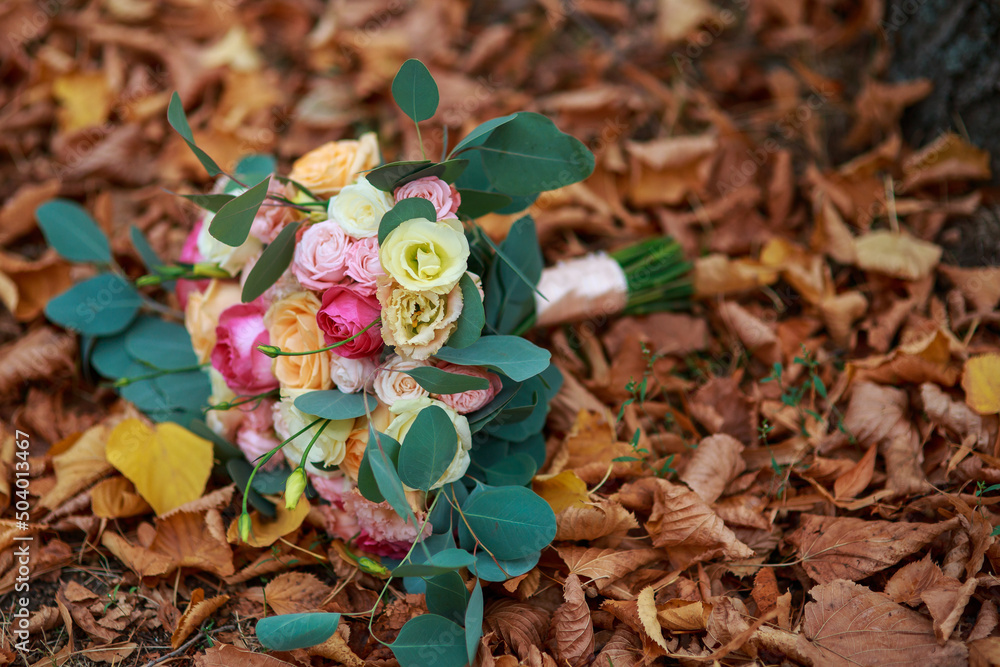 Wedding bridal bouquet. Floristry for a wedding ceremony. Autumn wedding concept. Wedding accessories