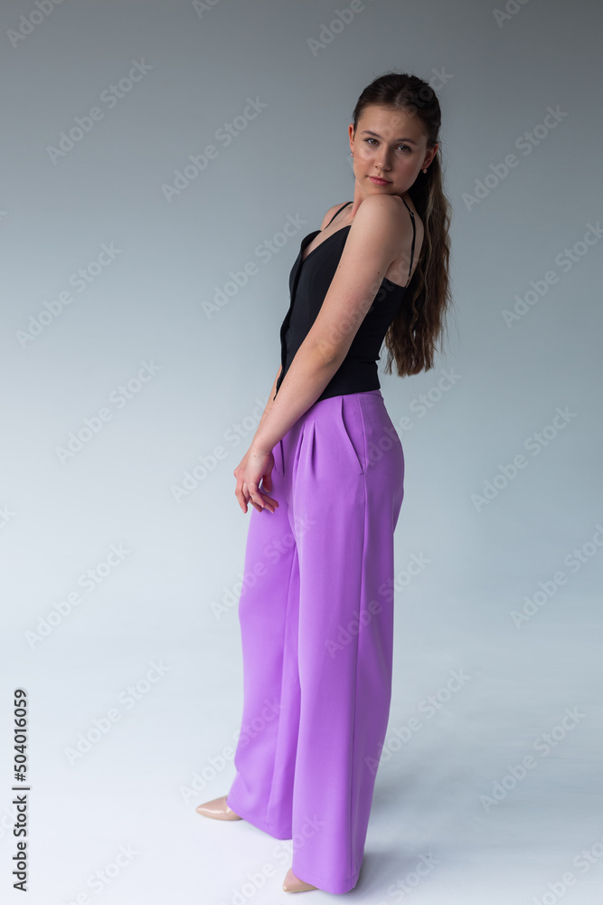 Elegant young woman in suit. Businesswoman on white background Elegant young woman in suit. Businesswoman on white background