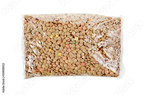 Lentils in a transparent plastic bag isolated on a white background. Top view.