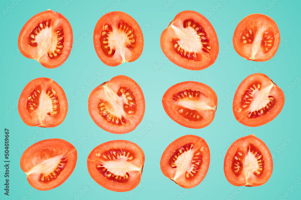 sliced tomatoes on a blue background, a lot of ripe tomatoes sliced tomatoes on a blue background, a lot of ripe tomatoes