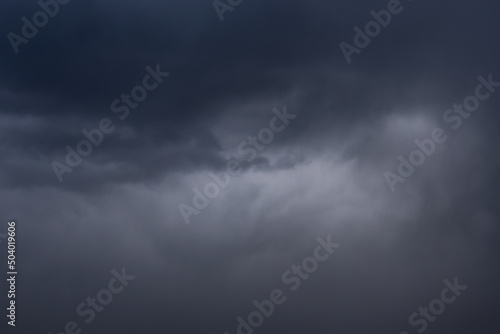 Dark clouds in the evening, a suitable thunderstorm, a dark beautiful sky in black tones