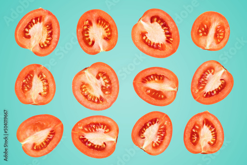 sliced tomatoes on a blue background, a lot of ripe tomatoes
