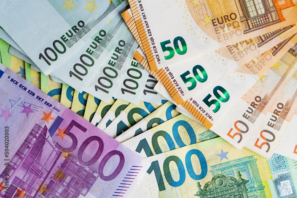 Lot of paper banknotes five hundred one hundred and fifty euro. Top view. Pile of money Lot of paper banknotes five hundred one hundred and fifty euro. Top view. Pile of money