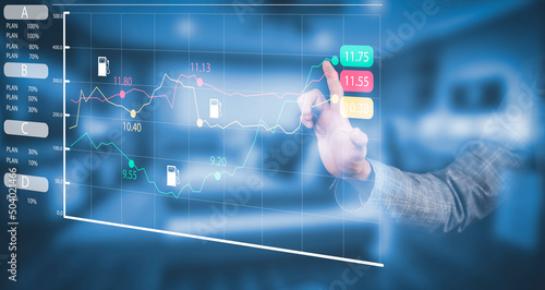 Oil energy graph of the world market, impact on the economic concept, Businessman touch chart with the indicator on the oil price slide at a gas station, fluctuations in oil prices and exchange trade.