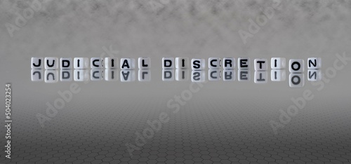 Quadro em tela judicial discretion word or concept represented by black and white letter cubes
