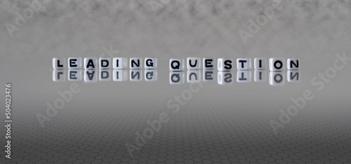 leading question word or concept represented by black and white letter cubes on a grey horizon background stretching to infinity