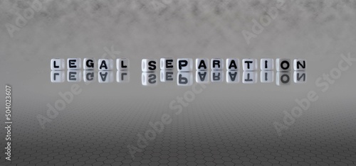 legal separation word or concept represented by black and white letter cubes on a grey horizon background stretching to infinity