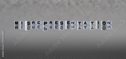 misrepresentation word or concept represented by black and white letter cubes on a grey horizon background stretching to infinity