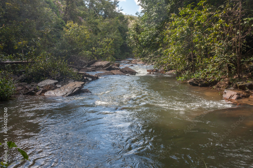 The small Itiquira River that flowing down from the Indaia waterfall near Planaltina, and Formosa, Goias, Brazil The small Itiquira River that flowing down from the Indaia waterfall near Planaltina, and Formosa, Goias, Brazil