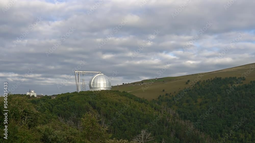 A space observatory high in the mountains among green forests, clouds and clean air. Observation of celestial bodies. A space observatory high in the mountains among green forests, clouds and clean air. Observation of celestial bodies.