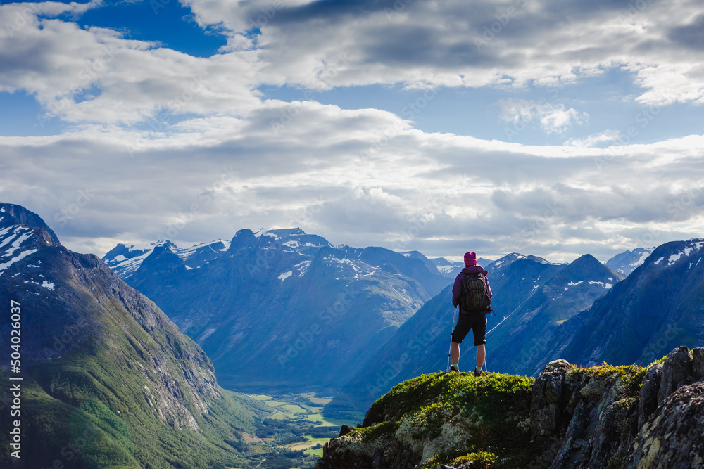 Hiker on the mountain top. Sport and active life concept