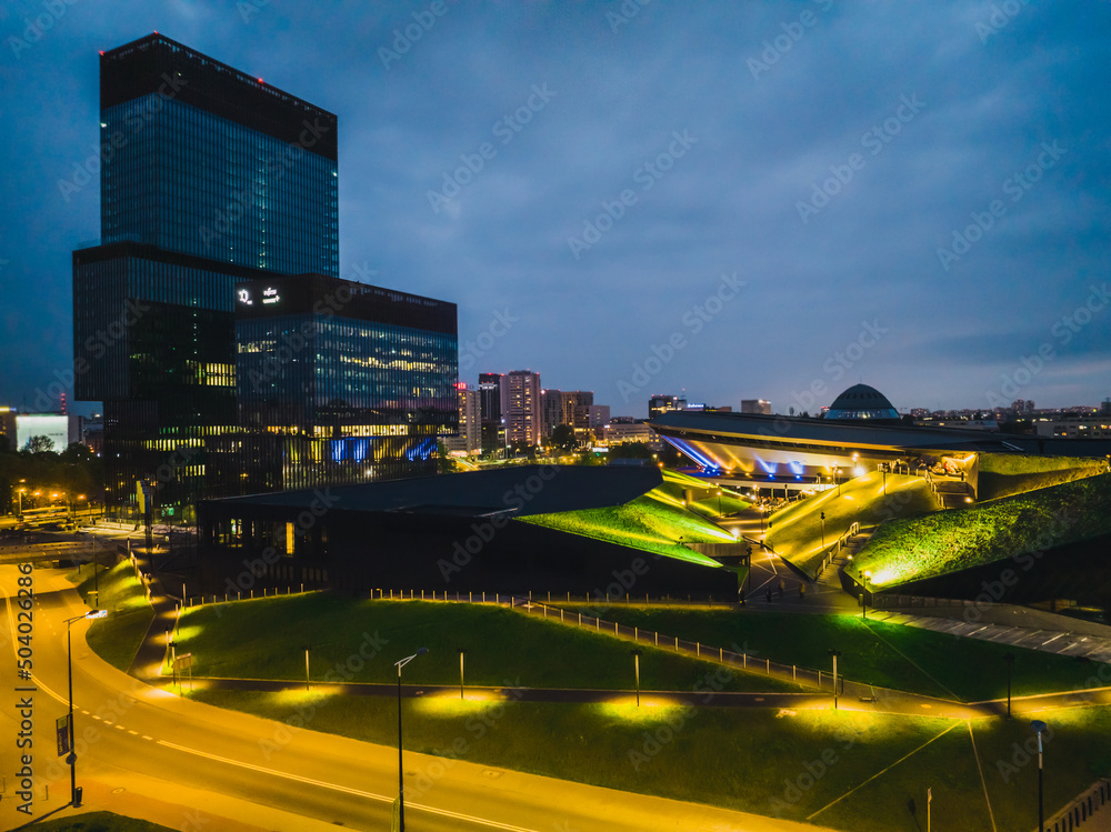 Obraz na płótnie Katowice, May 8, 2022, Poland, Silesia. View of Katowice at night from a drone. View of the saucer in Katowice and the KTW building. Katowice city concept at night aerail view. w salonie