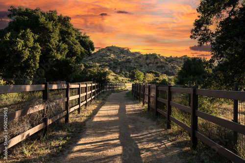 Sunrise view of equestrian trail leading to Chatsworth Park South in the San Fernando Valley area of Los Angeles, California. photo