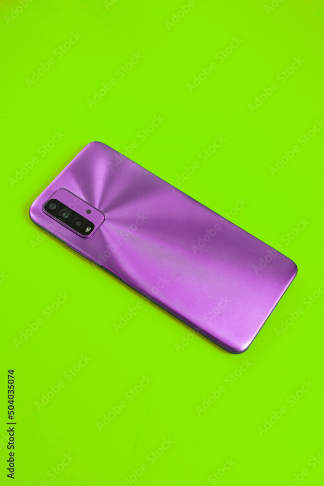 New cell phone over colorful background New cell phone over colorful background